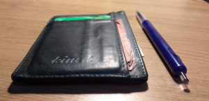 Placed next to a pen, it's easy to see how slim the Kindz wallet is